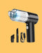 Black handheld vacuum cleaner with attachments on a yellow background